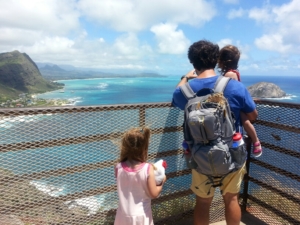 Daddy and daughters, enjoying the view.