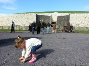 R investigating pebbles at Newgrange, outside of Dublin.