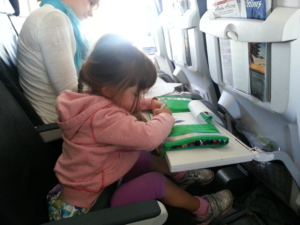 Little R, mid-flight, on her first diaper-free plane trip.